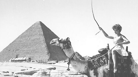 Gail Howard riding a camel near Giza Pyramids          